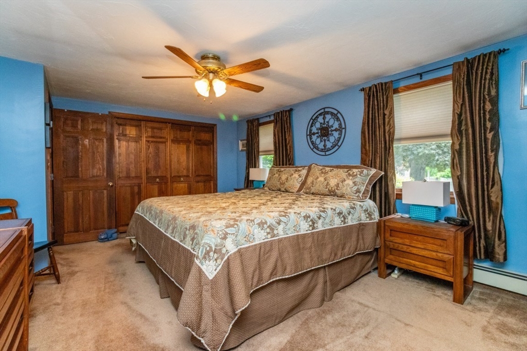 118 Bruce Road Walpole, MA 02081 - Photo 13 of 30 a bedroom with a bed and a large window