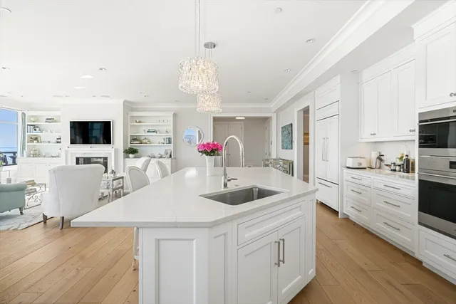 a dining room with furniture and a floor to ceiling window