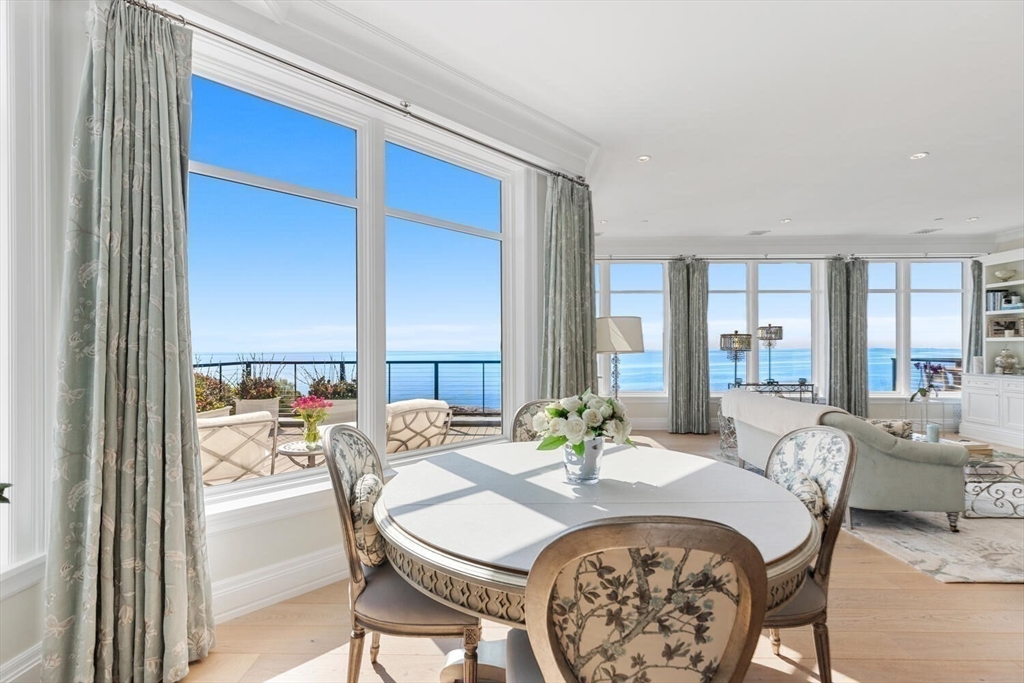 35 Littles Point Road, Unit S201 Swampscott, MA 01907 - Photo 12 of 36 a dining room with furniture and a floor to ceiling window