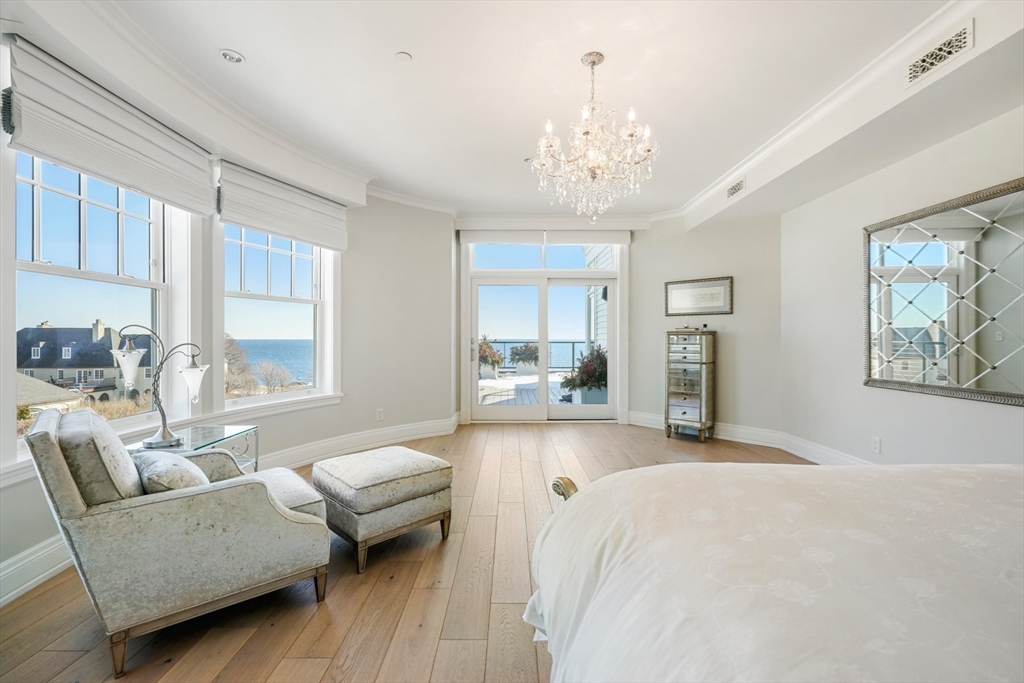 35 Littles Point Road, Unit S201 Swampscott, MA 01907 - Photo 15 of 36 a living room with furniture and a chandelier