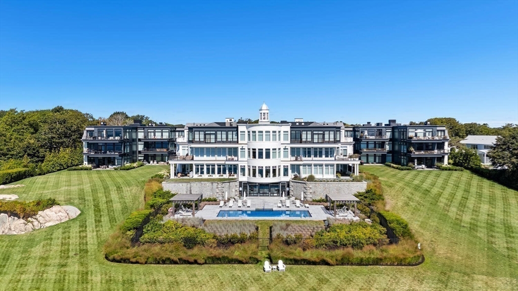 35 Littles Point Road, Unit S201 Swampscott, MA 01907 - Photo 2 of 36 a view of a swimming pool with a garden