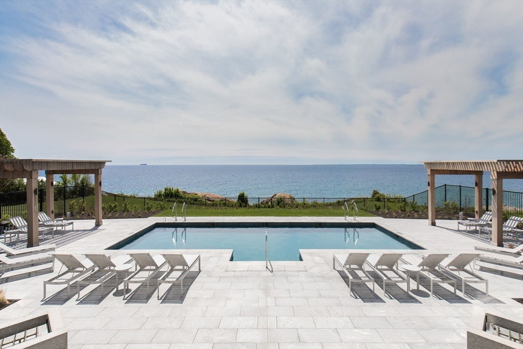 35 Littles Point Road, Unit S201 Swampscott, MA 01907 - Photo 25 of 36 a view of a swimming pool and a lounge chair