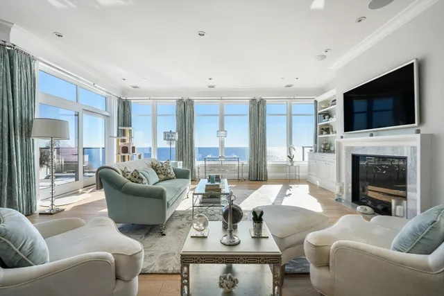 a living room with fireplace furniture and a flat screen tv