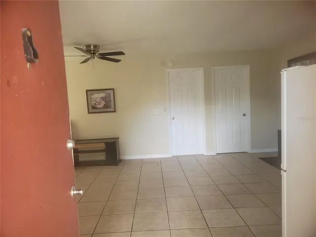 a view of an empty room with a window