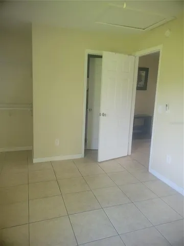 a view of an empty room and closet