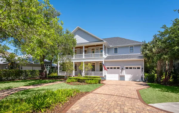 a view of a patio with dining table and chairs
