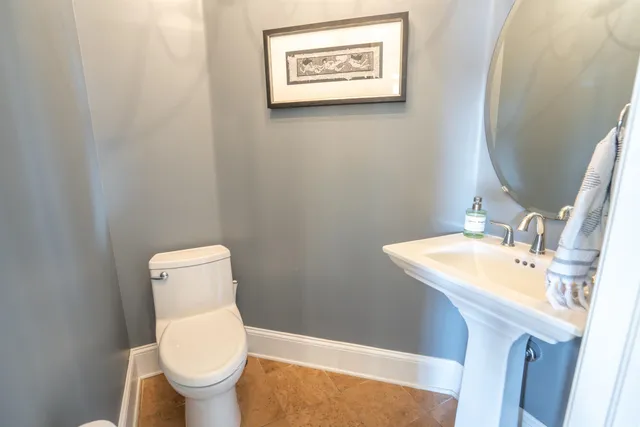 a view of a patio with dining table and chairs