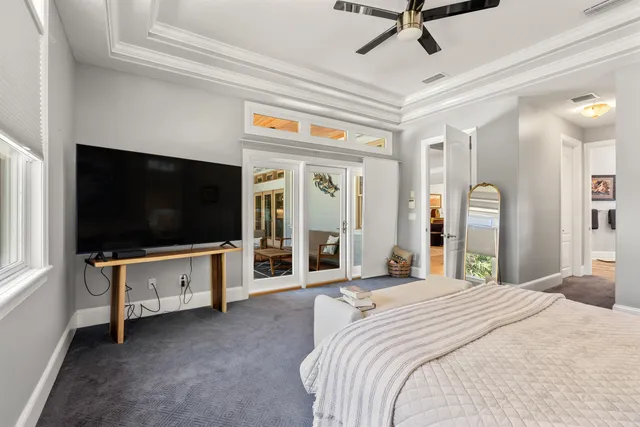 a room with pool table and windows