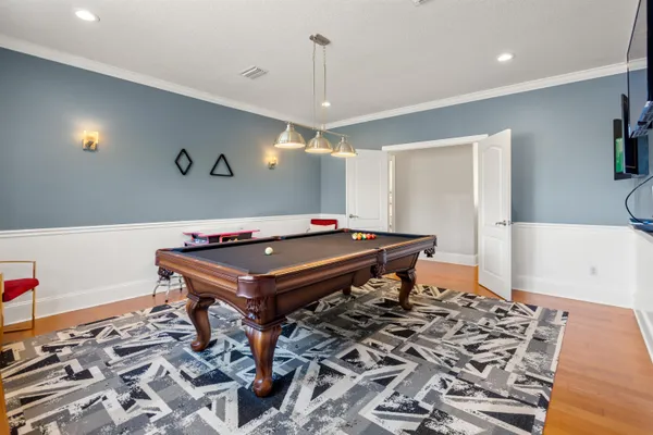 a view of a house with swimming pool and sitting area