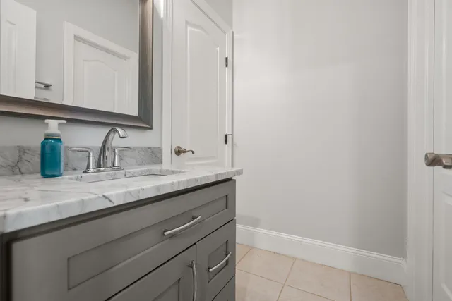 an aerial view of house with yard and mountain view in back