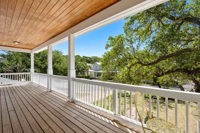 a view of a swimming pool with an outdoor seating and a yard