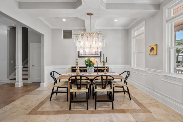 a living room with furniture and a flat screen tv with wooden floor