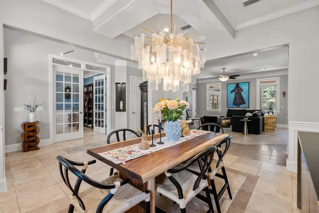 a living room with furniture ceiling fan and a window