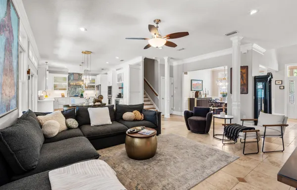a dining room with furniture a chandelier and fireplace