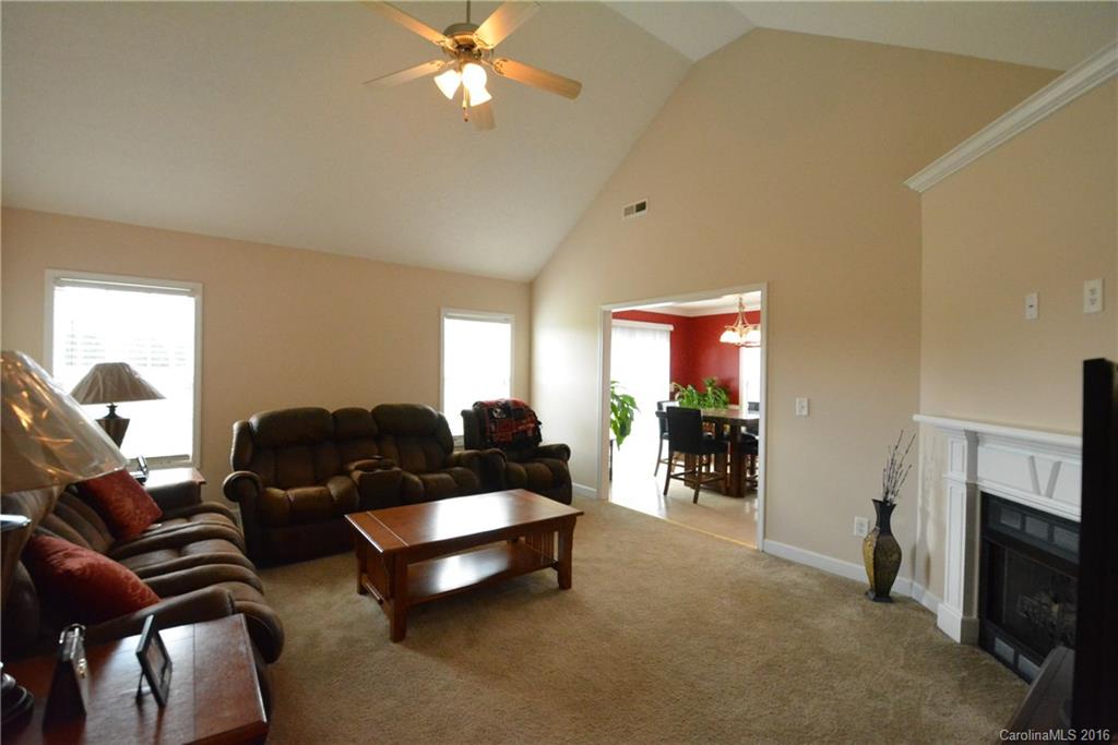 214 Pendergrass Road York, SC 29745 - Photo 2 of 21 a living room with furniture and a fireplace