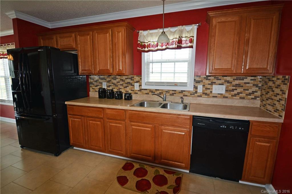214 Pendergrass Road York, SC 29745 - Photo 17 of 21 a kitchen with stainless steel appliances granite countertop a refrigerator and a sink