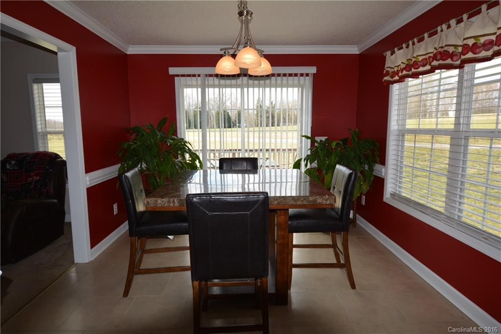 214 Pendergrass Road York, SC 29745 - Photo 5 of 21 a view of a dining room with furniture window and outside view