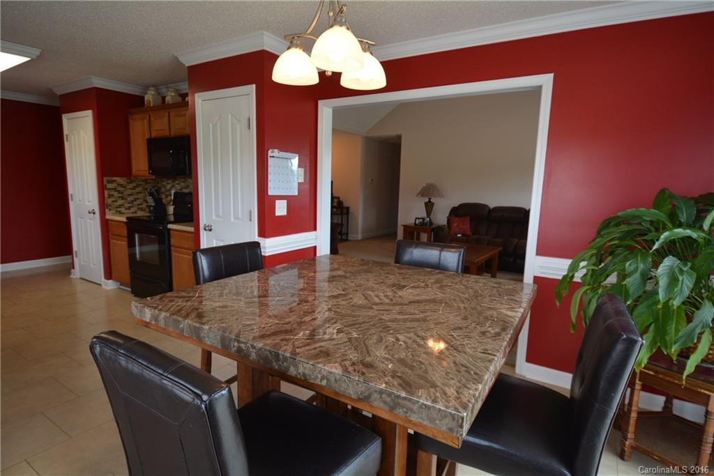 214 Pendergrass Road York, SC 29745 - Photo 6 of 21 a view of a dining room with furniture and wooden floor