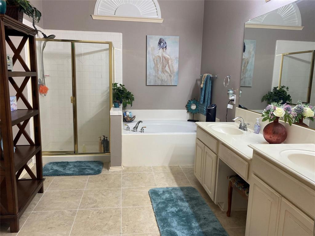 4025 Steepleridge Drive The Colony, TX 75056 - Photo 11 of 23 a bathroom with a tub sink and mirror