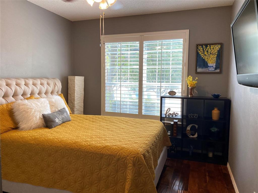 4025 Steepleridge Drive The Colony, TX 75056 - Photo 13 of 23 a bedroom with a bed and a tv on table