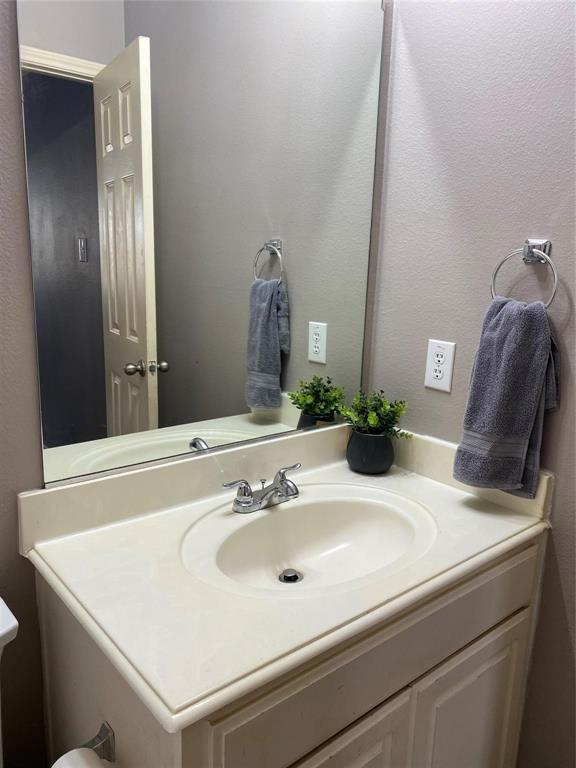4025 Steepleridge Drive The Colony, TX 75056 - Photo 14 of 23 a bathroom with a sink and a mirror