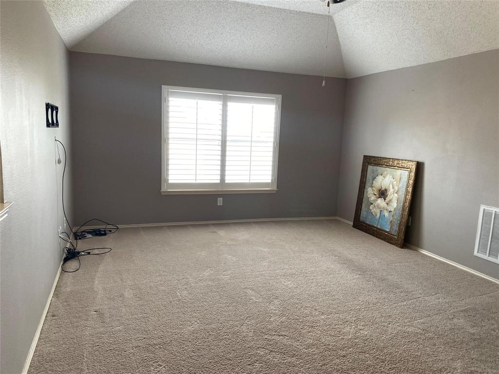 4025 Steepleridge Drive The Colony, TX 75056 - Photo 17 of 23 a view of an empty room with a window