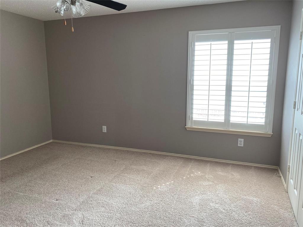 4025 Steepleridge Drive The Colony, TX 75056 - Photo 19 of 23 a view of an empty room with a window