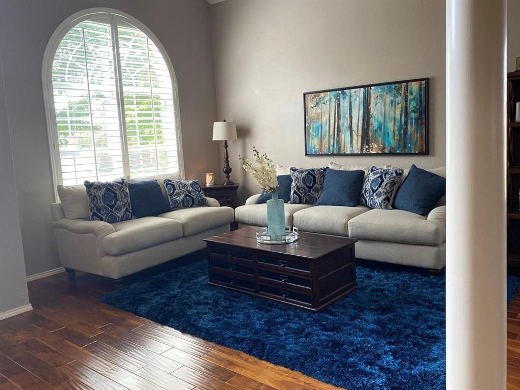 4025 Steepleridge Drive The Colony, TX 75056 - Photo 2 of 23 a living room with furniture and a large window