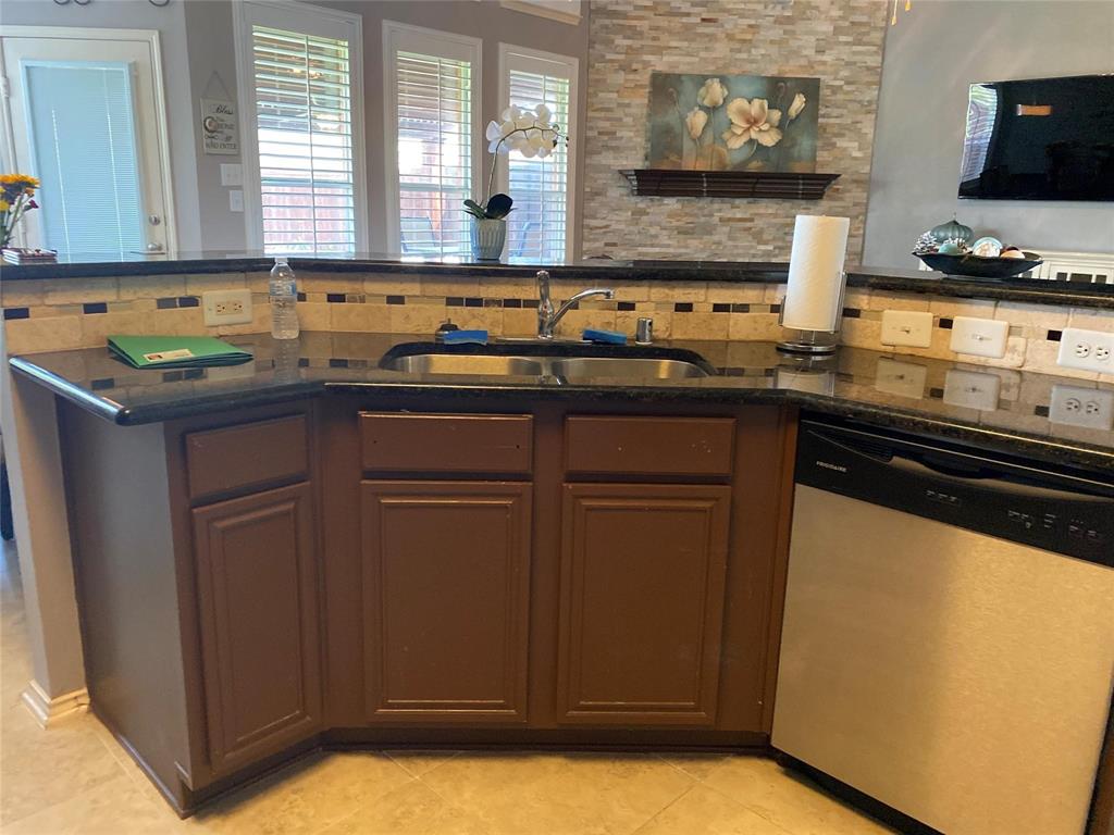 4025 Steepleridge Drive The Colony, TX 75056 - Photo 7 of 23 a kitchen with sink and cabinets