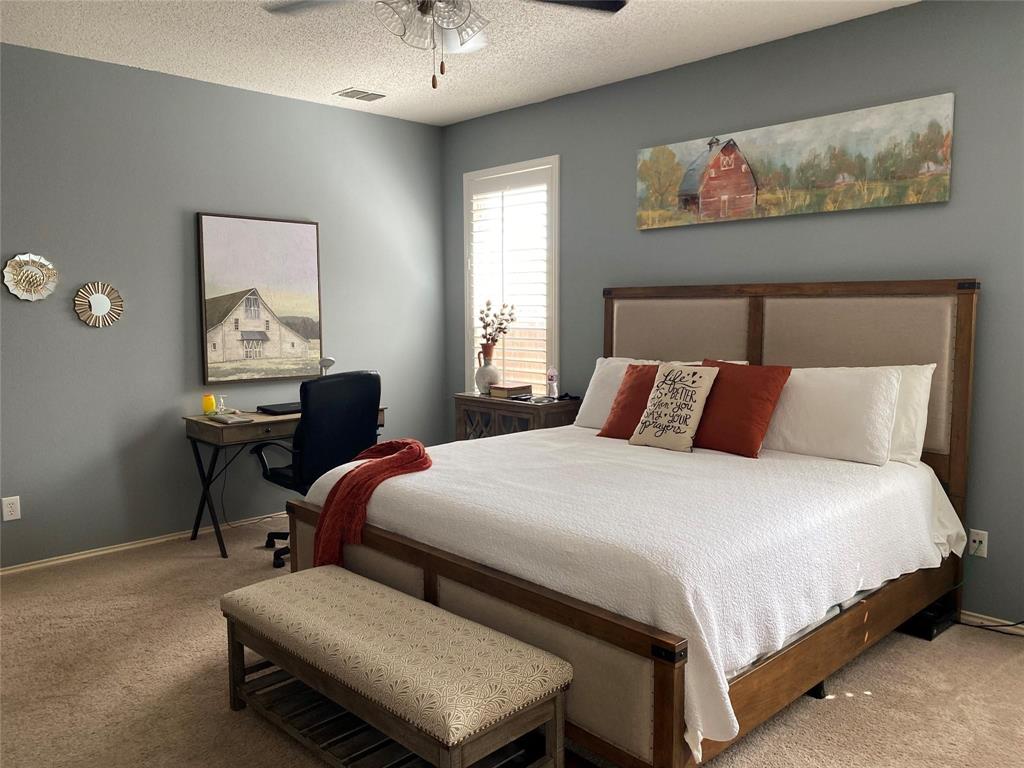 4025 Steepleridge Drive The Colony, TX 75056 - Photo 9 of 23 a bedroom with a bed and wooden floor