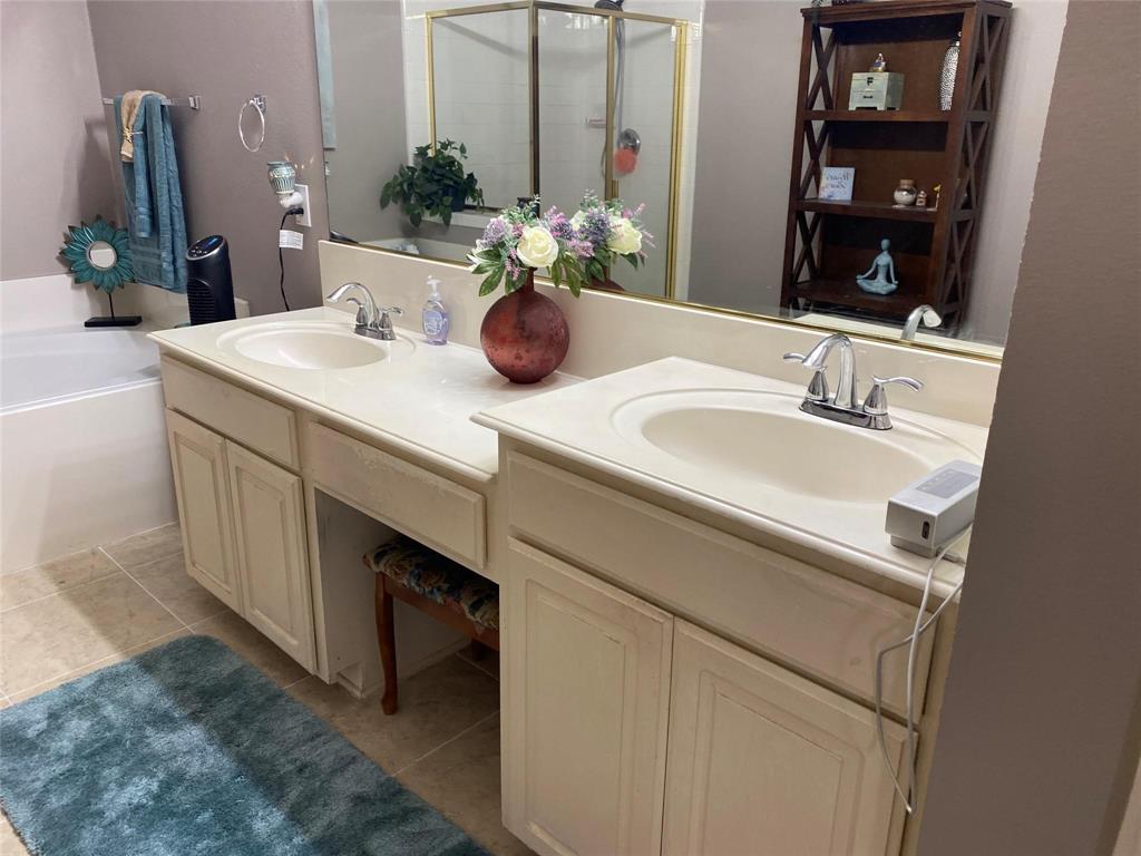 4025 Steepleridge Drive The Colony, TX 75056 - Photo 10 of 23 a bathroom with a sink and a mirror
