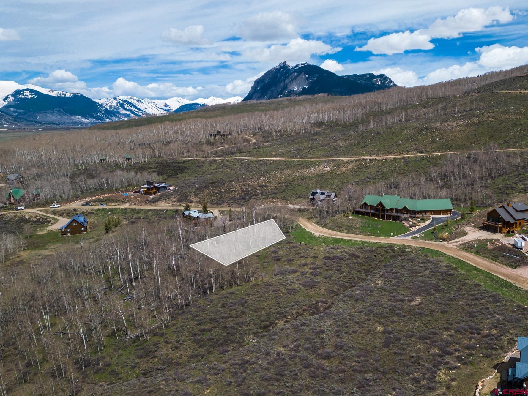 208 Neville Way Crested Butte, CO 81224 - Photo 1 of 12 a view of a lake with a mountain