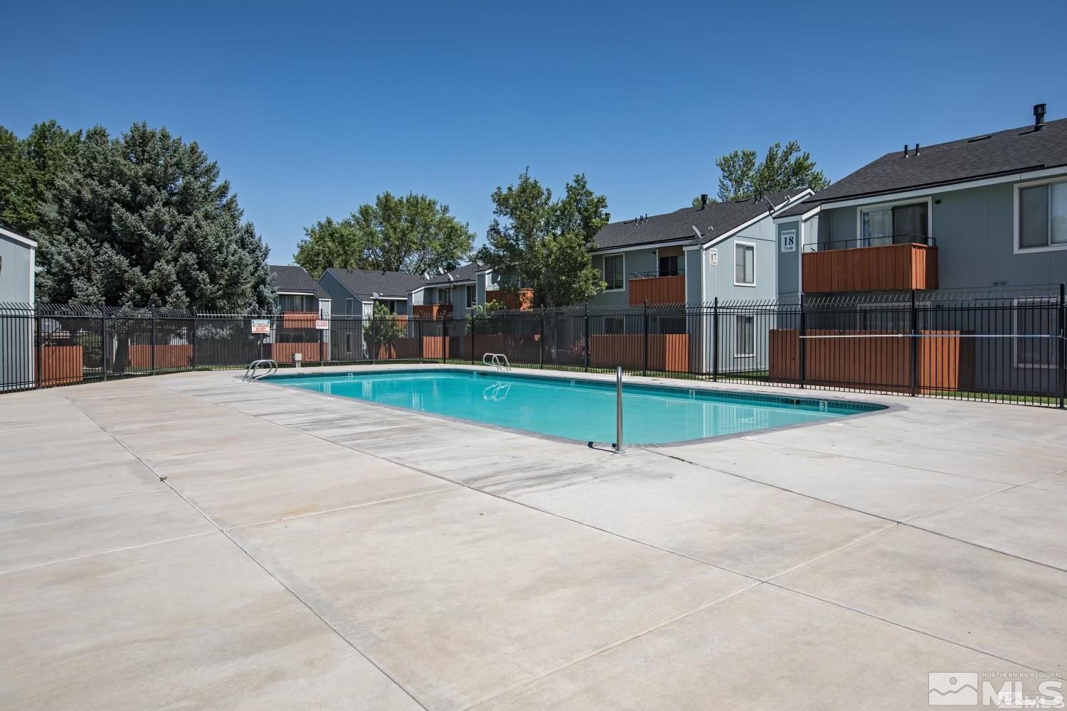 4600 Neil Road, Unit 44 Reno, NV 89502 - Photo 16 of 17 a view of house with entertaining space and palm trees