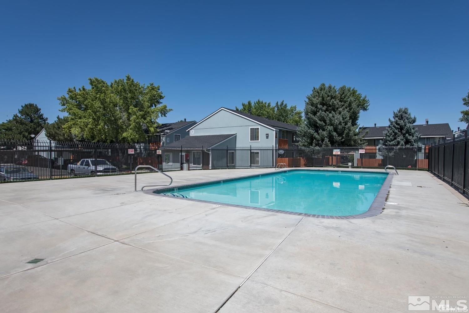 4600 Neil Road, Unit 44 Reno, NV 89502 - Photo 17 of 17 a view of a house with a swimming pool