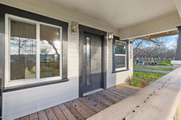 a bedroom with a large bed and a fireplace