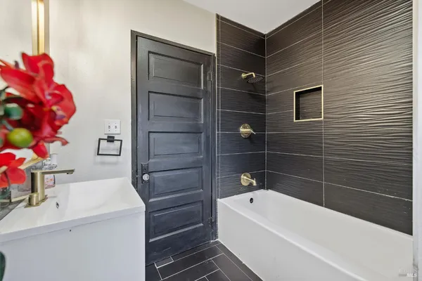 a view of a livingroom with furniture and a flat screen tv