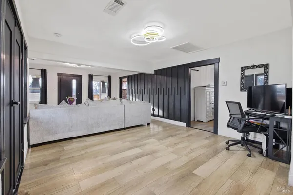 a bedroom with a bed and a dresser