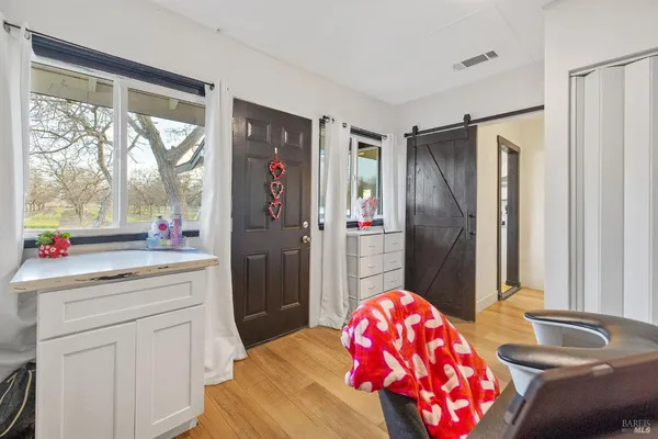 a workspace with furniture and wooden floor