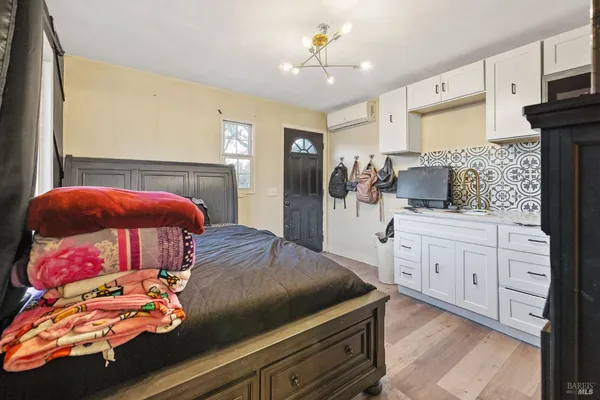 a bathroom with a sink a toilet and mirror