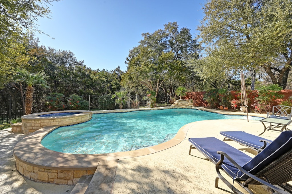 12304 Aralia Ridge Drive Austin, TX 78739 - Photo 35 of 37 a view of a backyard with swimming pool