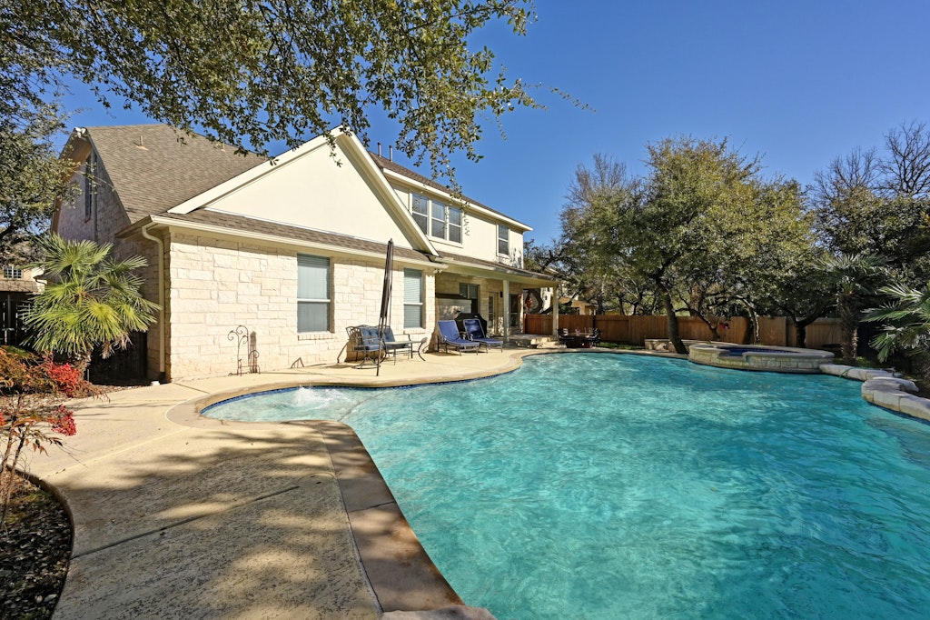 12304 Aralia Ridge Drive Austin, TX 78739 - Photo 36 of 37 a view of a house with backyard and sitting area