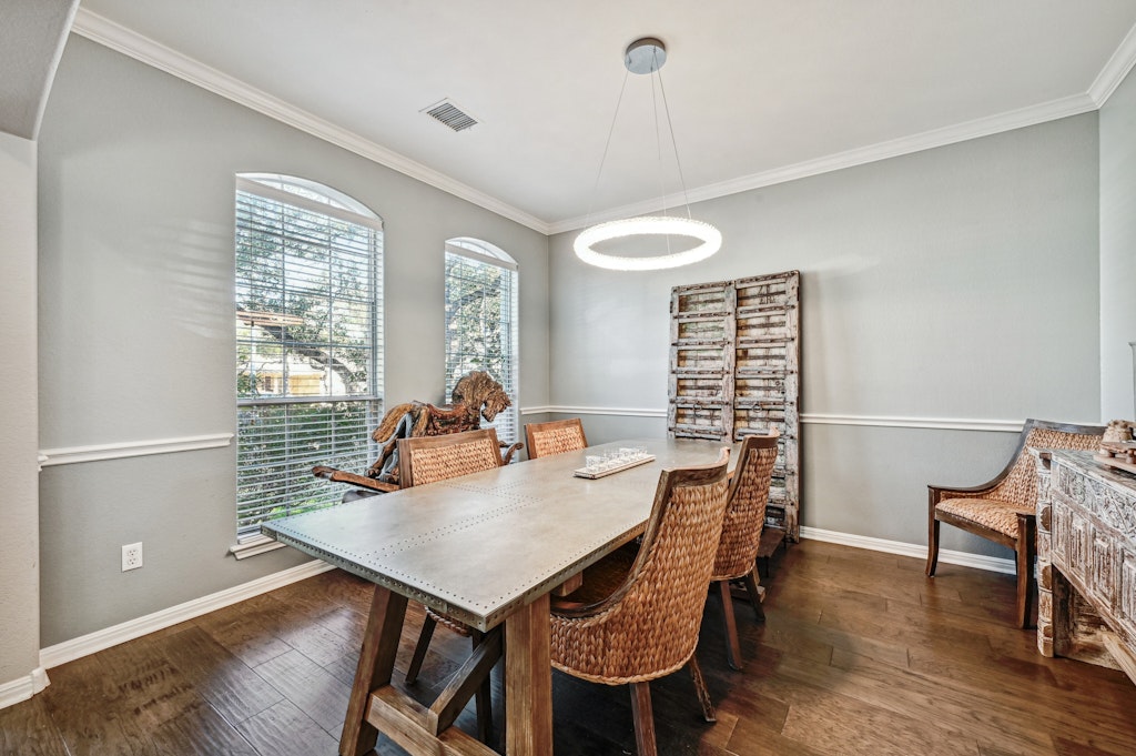 12304 Aralia Ridge Drive Austin, TX 78739 - Photo 7 of 37 a view of a dining room with furniture window and wooden floor