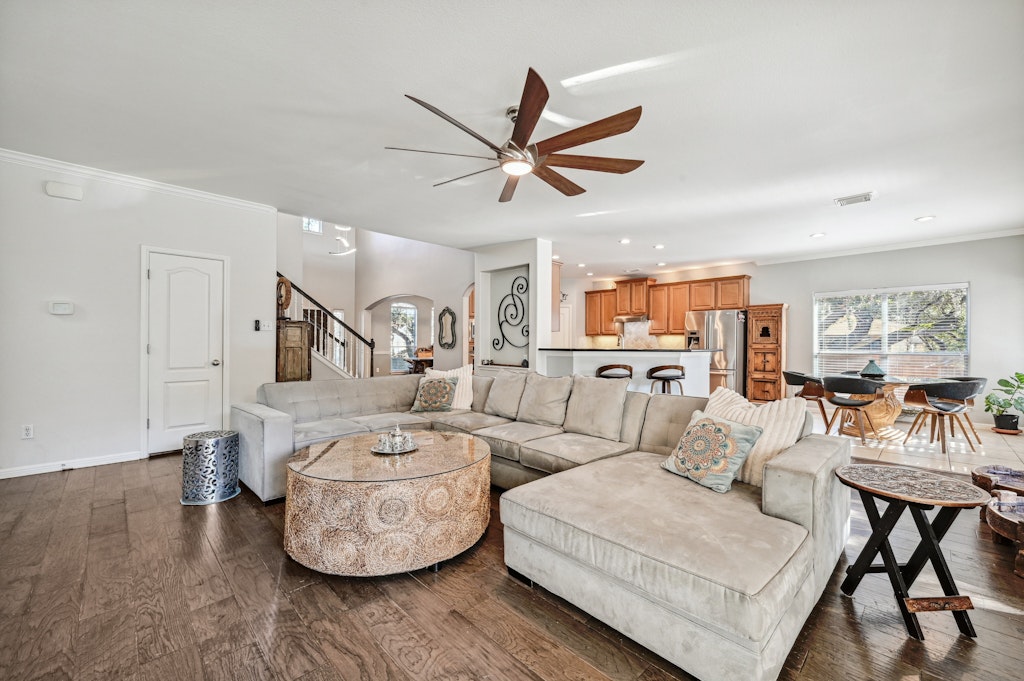12304 Aralia Ridge Drive Austin, TX 78739 - Photo 10 of 37 a living room with furniture and a wooden floor
