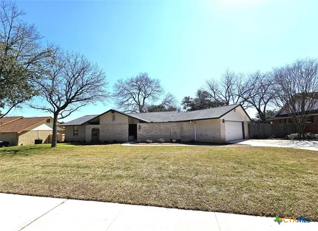 a house view with a garden space