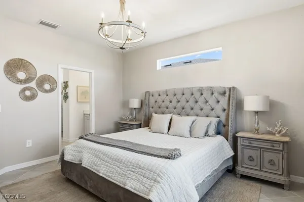a bedroom with a bed and ceiling fan