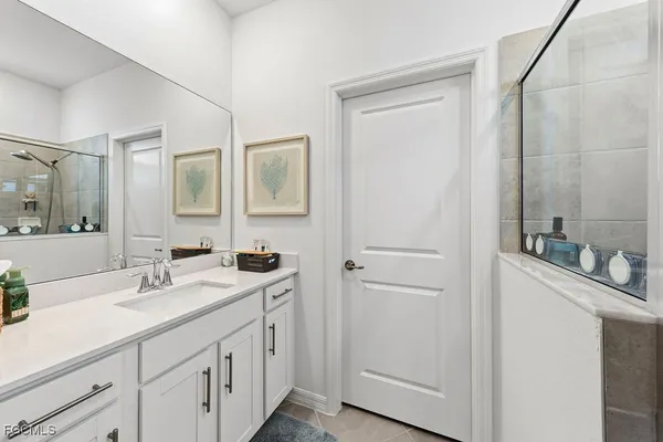 a bathroom with 2 sink and a mirror