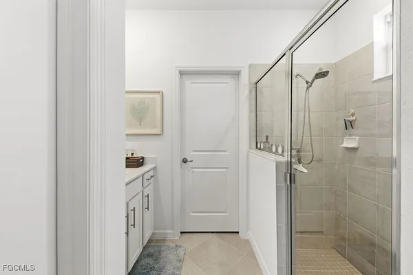 a bathroom with a bathtub and shower