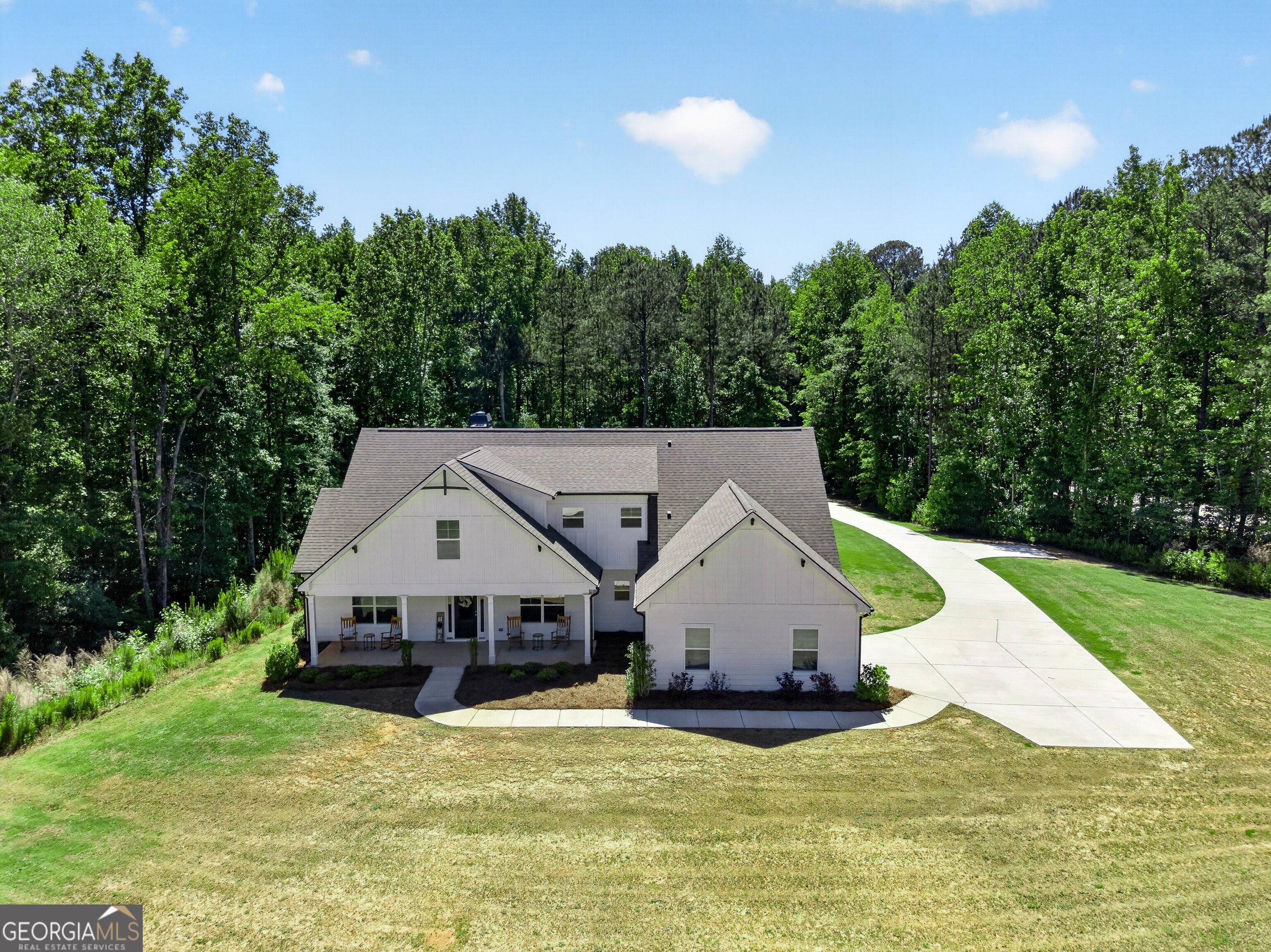 1764 Luther Bailey Road Senoia, GA 30276 - Photo 51 of 63 a view of a house with a yard and large trees