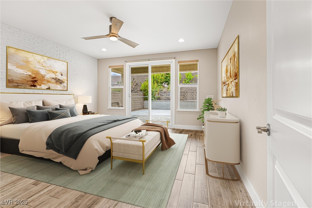 4631 Amazing View Street Las Vegas, NV 89129 - Photo 24 of 94 Bedroom with light wood-style flooring, access to exterior, a ceiling fan, recessed lighting, and brick wall