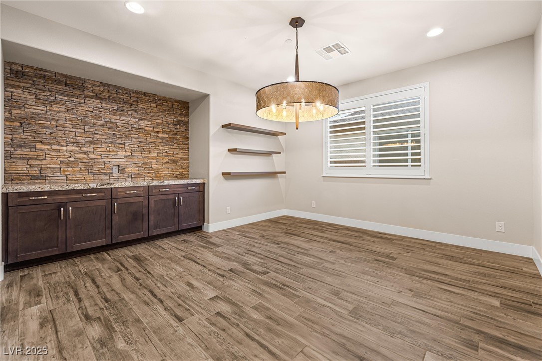 4631 Amazing View Street Las Vegas, NV 89129 - Photo 39 of 94 Unfurnished dining area with dark wood-style floors and recessed lighting